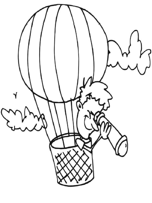 Boy Using Magnifying Glass On Hot Air Balloon